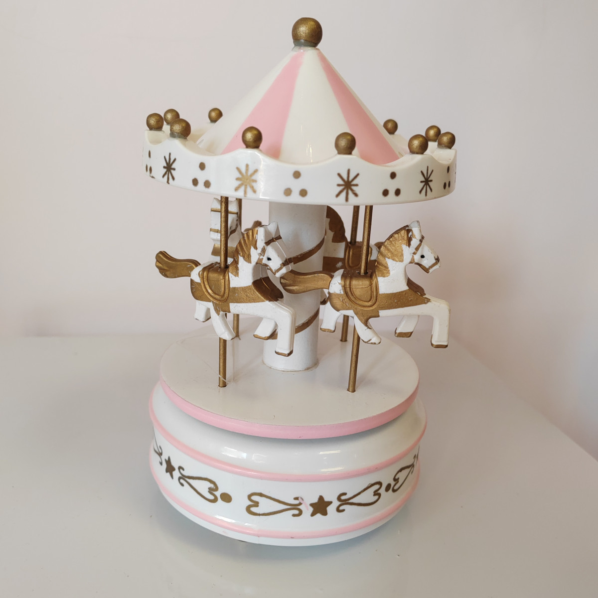 Carillon meccanico rosa con cavallucci